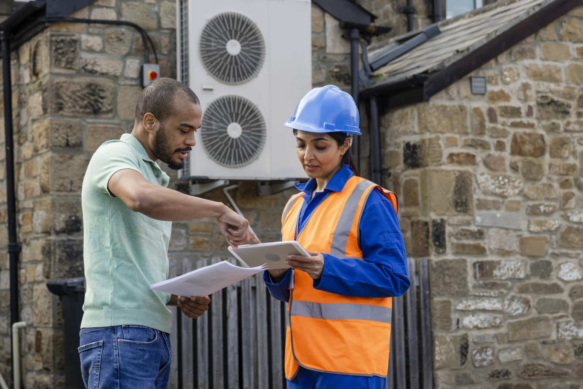 Engineer Working on an Air Source Heat Pump